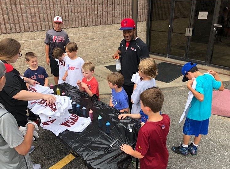 BVSA Summer Camp Tie-Dye Friday — campers and coaches making custom shirts at long tables outside the facility